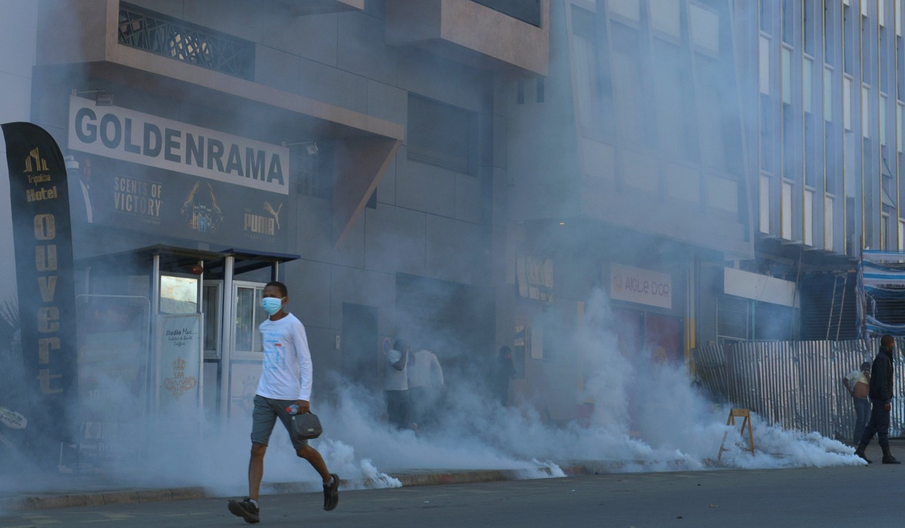 Riot police fire tear gas canisters to disperse demonstrators protesting in Antananarivo, Madagascar on Saturday. Photo: Reuters