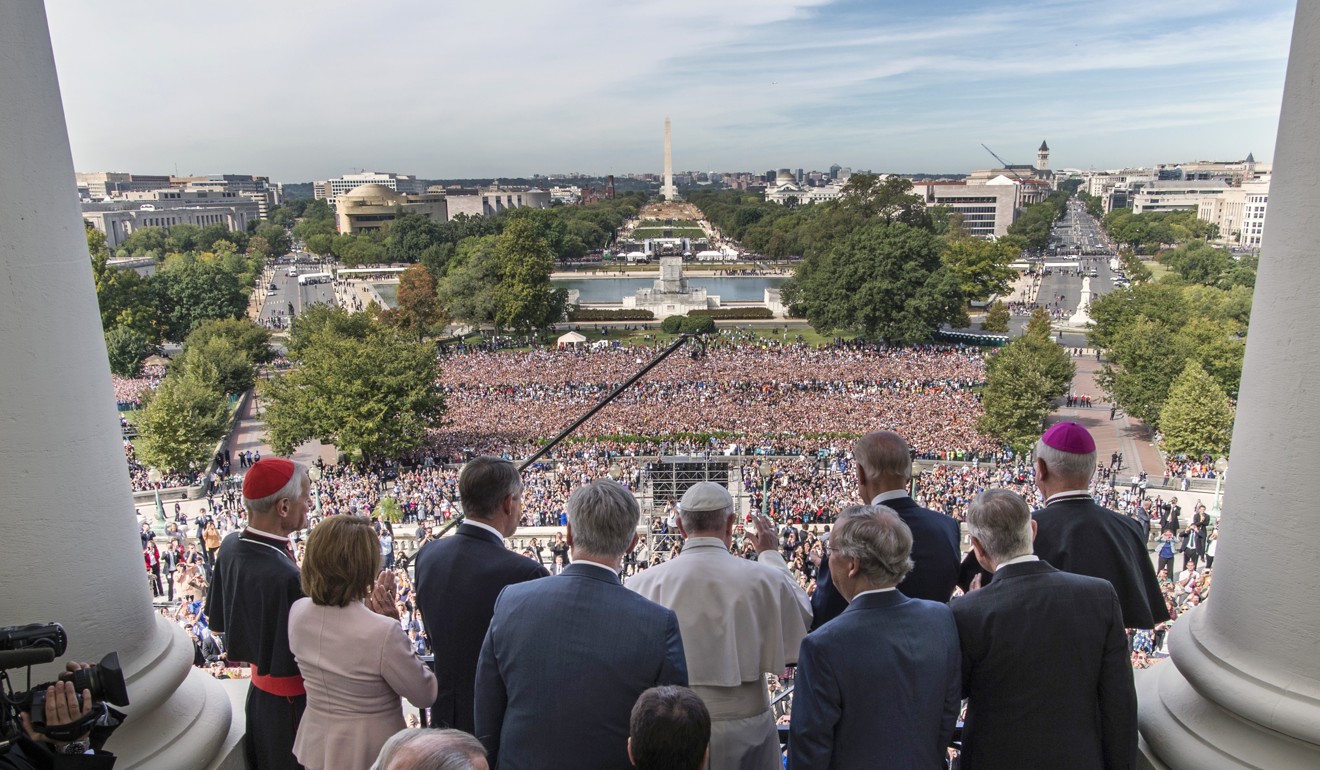 Pope Francis, centre, gathers with US House and Senate leadership plus local clergy on the west front of the US Capitol building after the Pope’s address to the joint session of Congress on September 24, 2015. Photo: AP