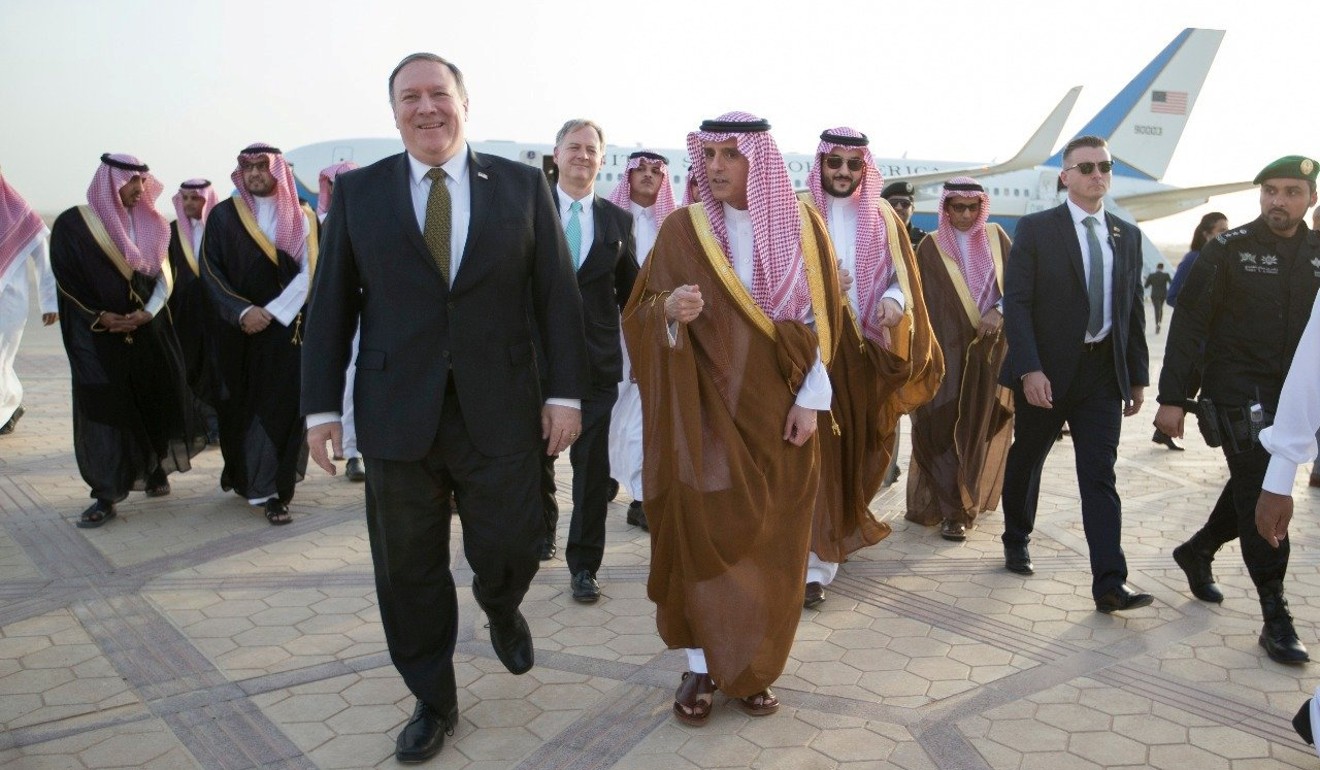Pompeo walks with Jubeir upon his arrival in Riyadh on Friday. Photo: Saudi Press Agency handout via Reuters