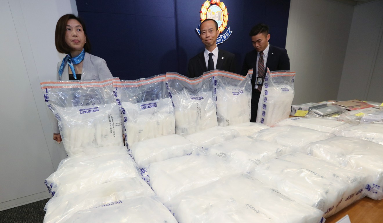 The two arrested men will appear in the West Kowloon Magistrates’ Courts on Thursday charged with trafficking of dangerous drugs. Photo: Felix Wong