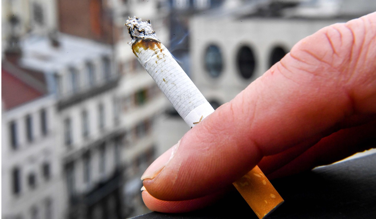 A cigarette smoker is pictured in Lille, northern France, in March. Photo: Agence France-Presse
