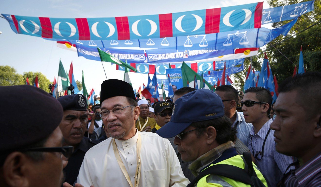 Malaysia's opposition leader Anwar Ibrahim, arrives to submit a nomination paper for the general election in Berapit 350km from Kuala Lumpur. Photo: AP