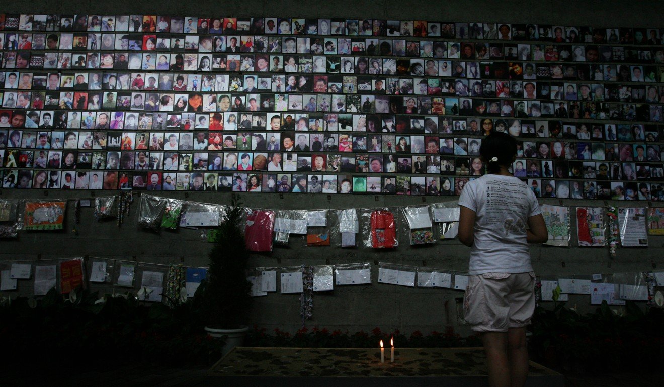 In an exhibition one month after the disaster, a museum in Jianchuan, Sichuan province, displays photos of some of the people killed in the quake. Photo: Ricky Chung