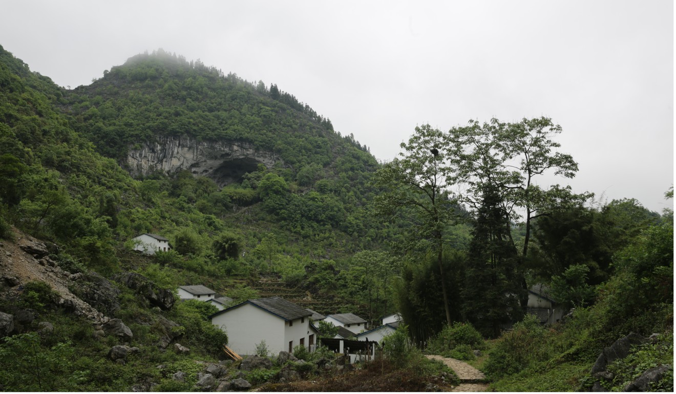 New brick houses beneath the cave were built by the government for the villagers. Photo: Lea Li