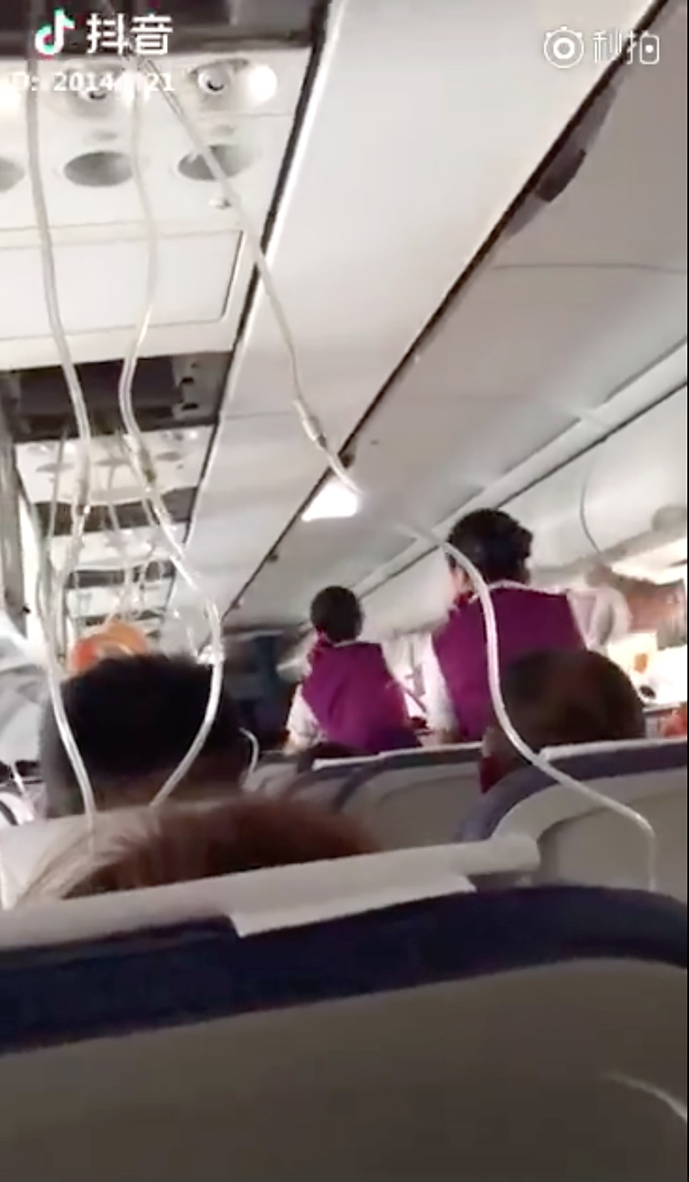 Oxygen masks were deployed when the cockpit window fell out. Photo: Weibo