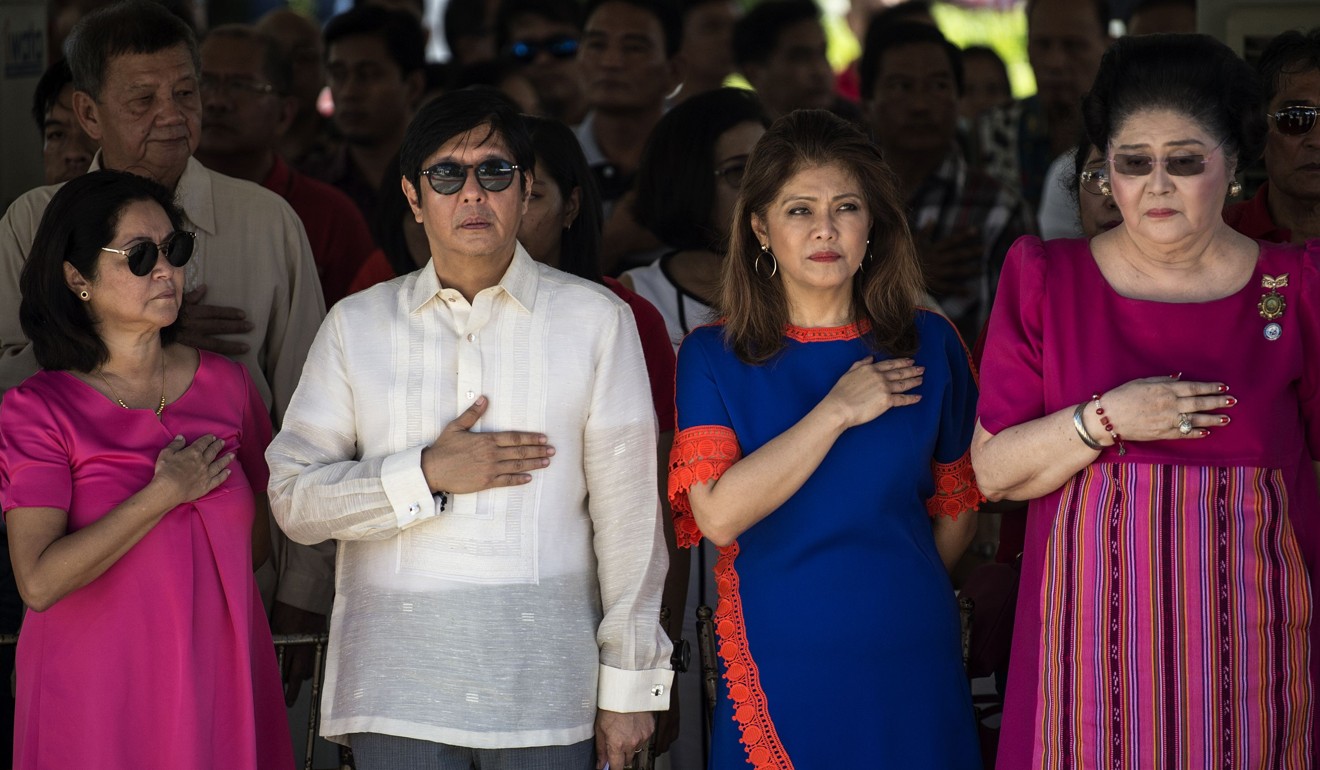 Imelda Marcos (right), the widow of former Philippine President Ferdinand Marcos, with Ferdinand Bongbong Marcos Jnr (white shirt) and his sister Imee (blue dress) at a wreath-laying ceremony at a monument to Ferdinand Marcos in 2017. Photo: AFP