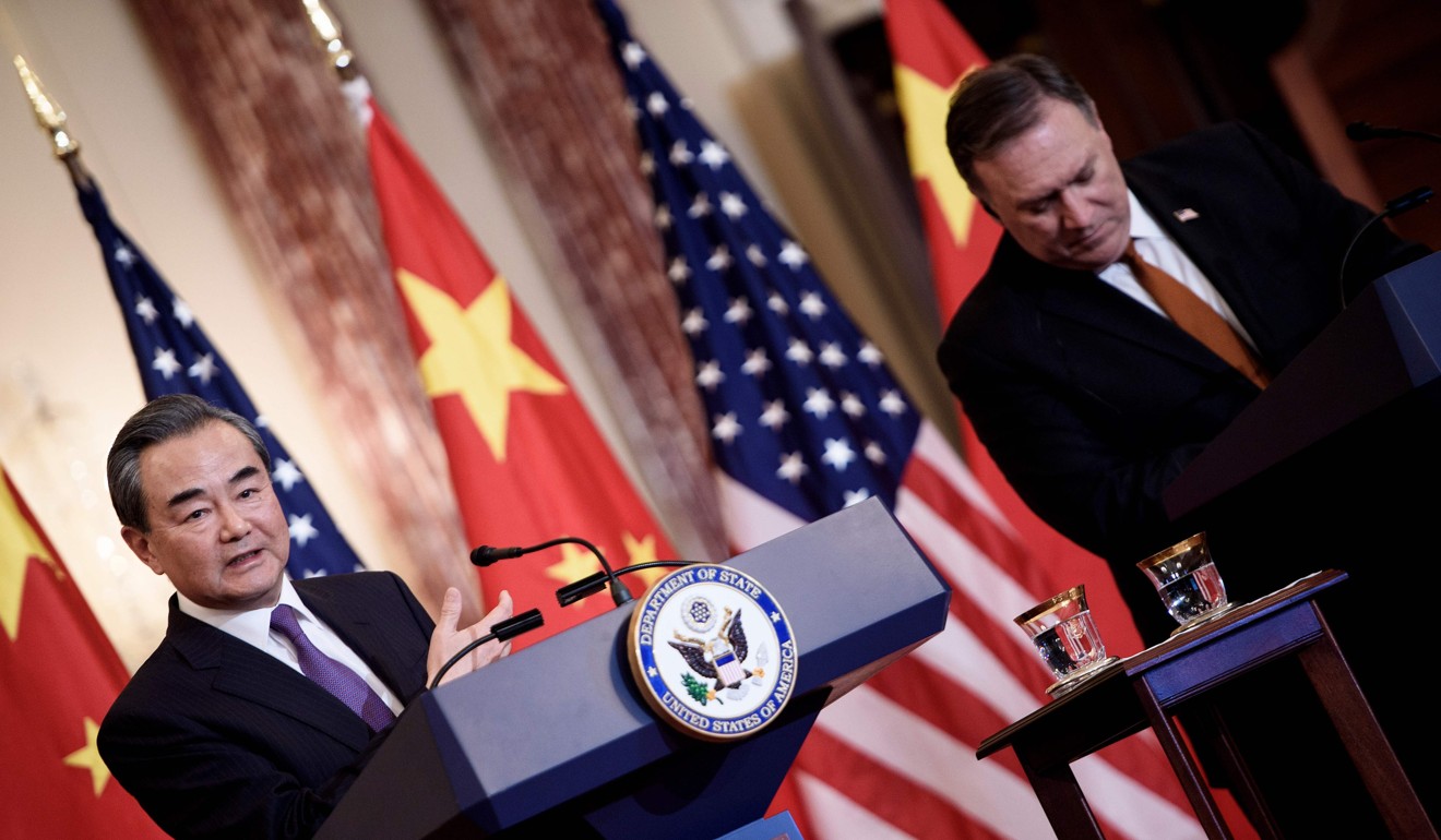 US Secretary of State Mike Pompeo (right) listens while Chinese Foreign Minister Wang Yi speaks at the State Department in Washington on Wednesday. Photo: AFP