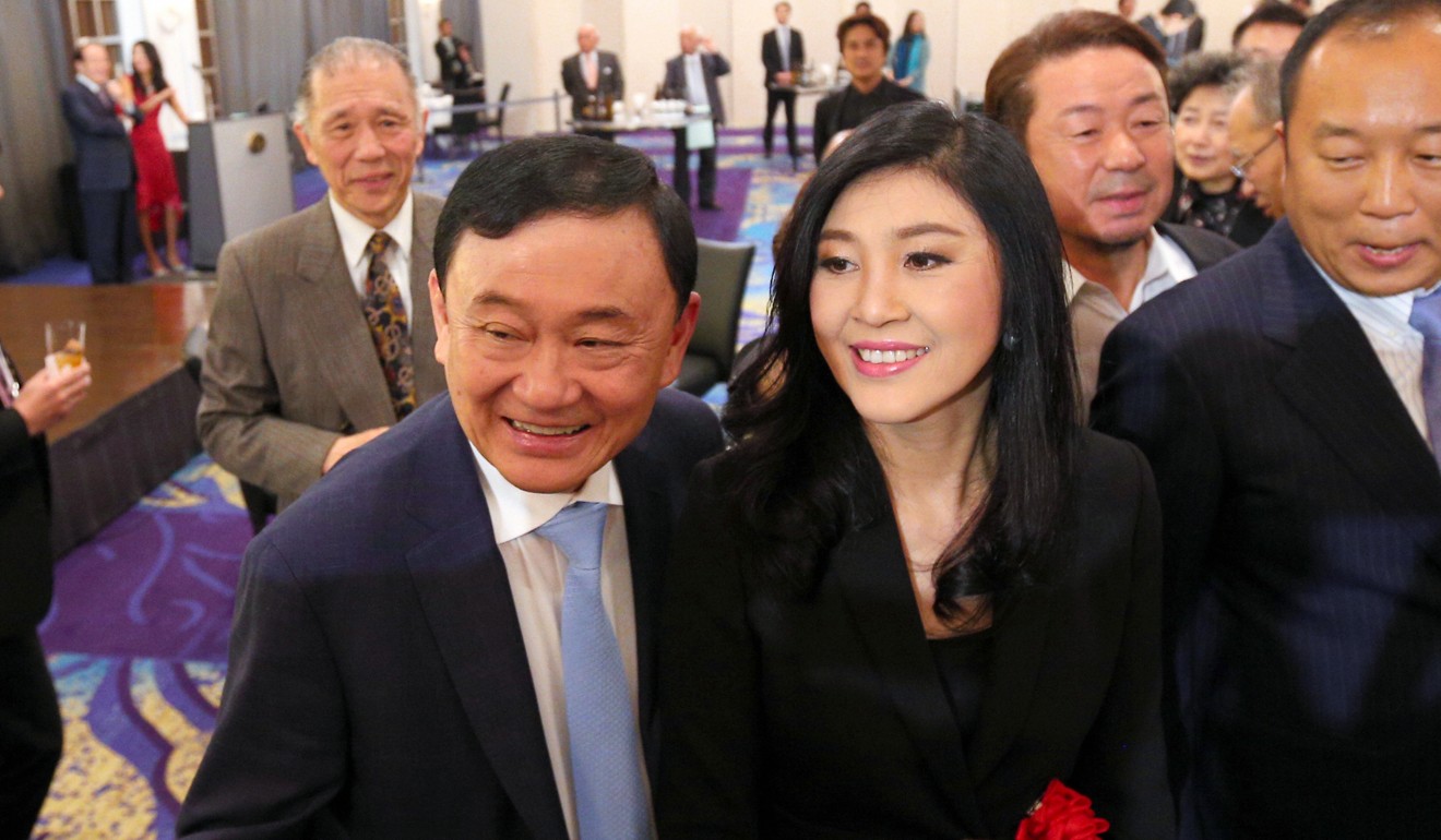 Former Thai prime ministers Thaksin Shinawatra and his sister Yingluck Shinawatra in Tokyo in March. Photo: AFP