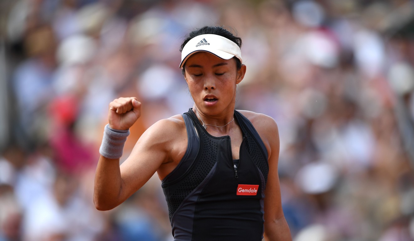 China’s Wang Qiang reacts after winning a point against Venus Williams. Photo: AFP