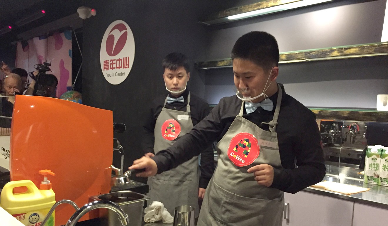 Dai Wangcheng (right) makes an espresso at A-Coffee on Friday. Photo: Alice Yan
