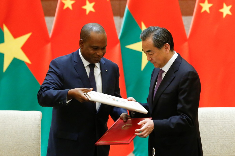 China’s Foreign Minister Wang Yi and Burkina Faso’s Foreign Minister Alpha Barry attend a signing ceremony establishing diplomatic relations between the two countries in Beijing on May 26. Photo: Reuters