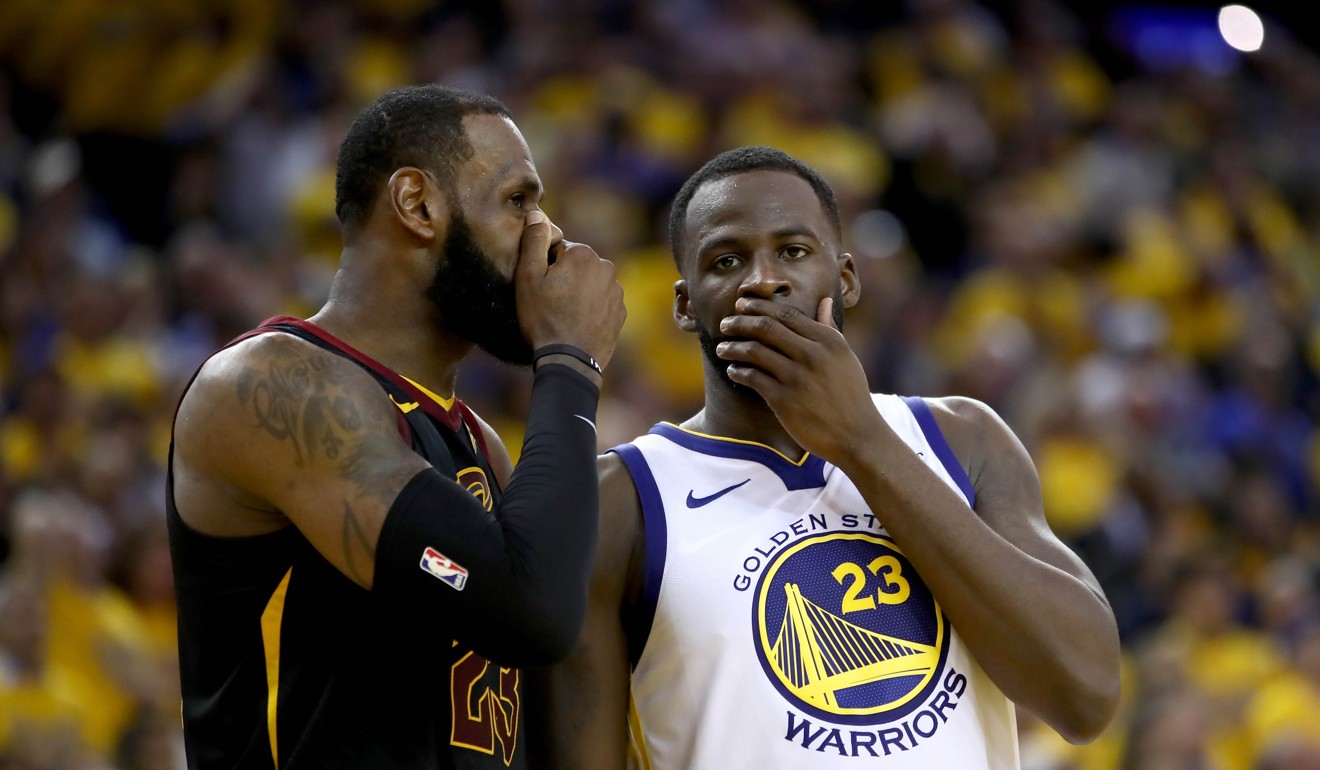 LeBron James of the Cleveland Cavaliers talks with Draymond Green of the Golden State Warriors. Photo: AFP