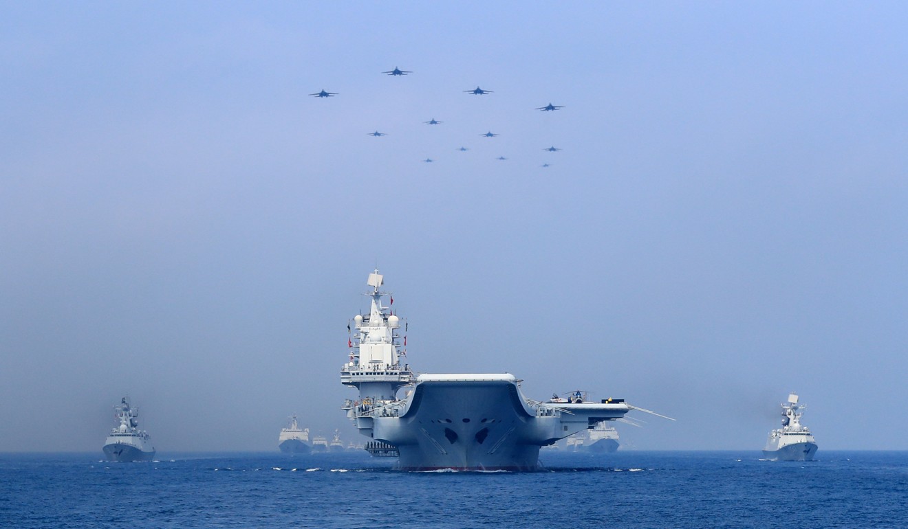 Warships and fighter jets of Chinese People's Liberation Army (PLA) Navy take part in a military display in the South China Sea April 12, 2018. Photo: Reuters