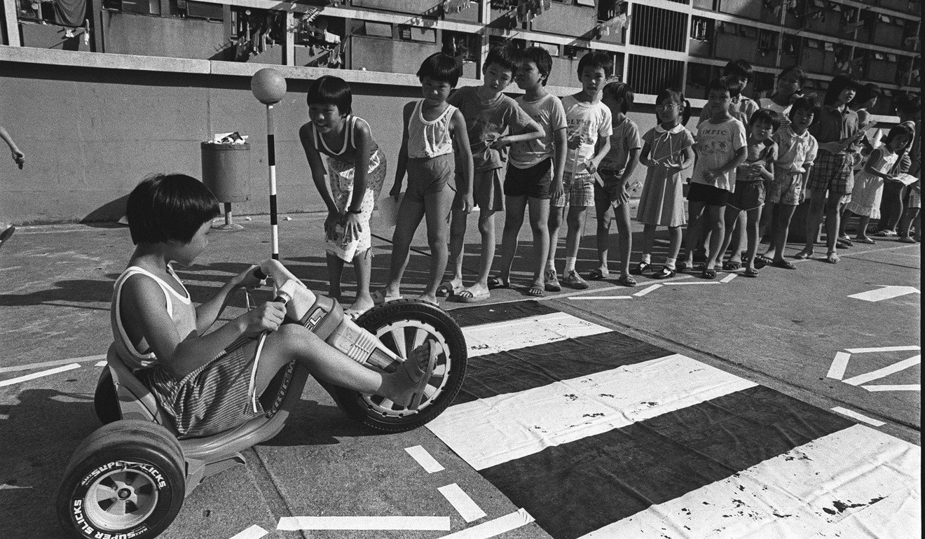 An archive photo from 1983 of youngsters being given a lesson in crossing the road on a road safety day in Wong Tai Sin. Photo: P.Y. Tang