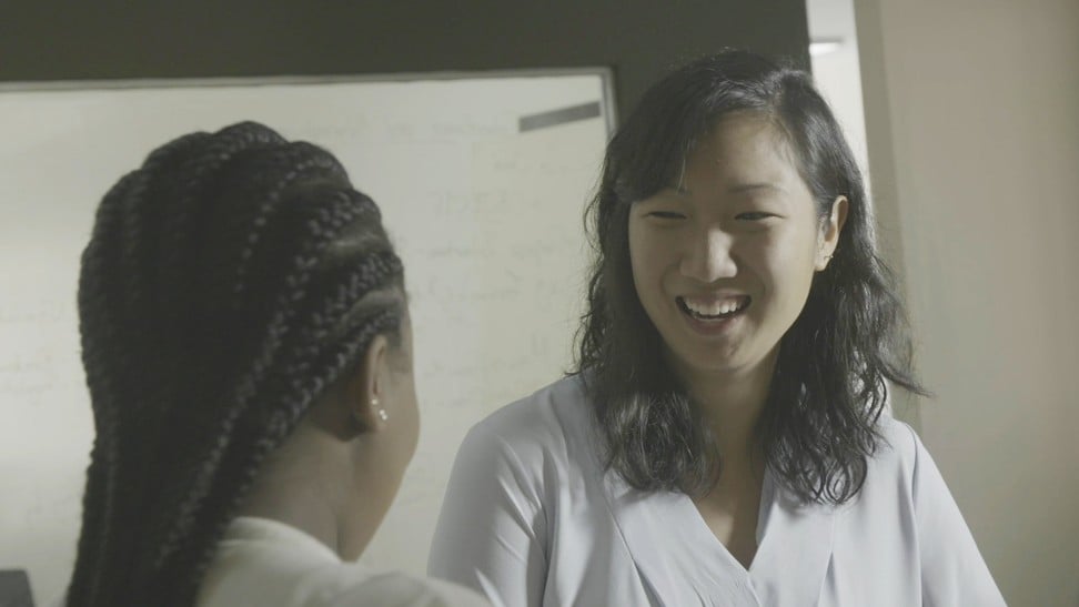 Audrey Cheng interacts with a student.