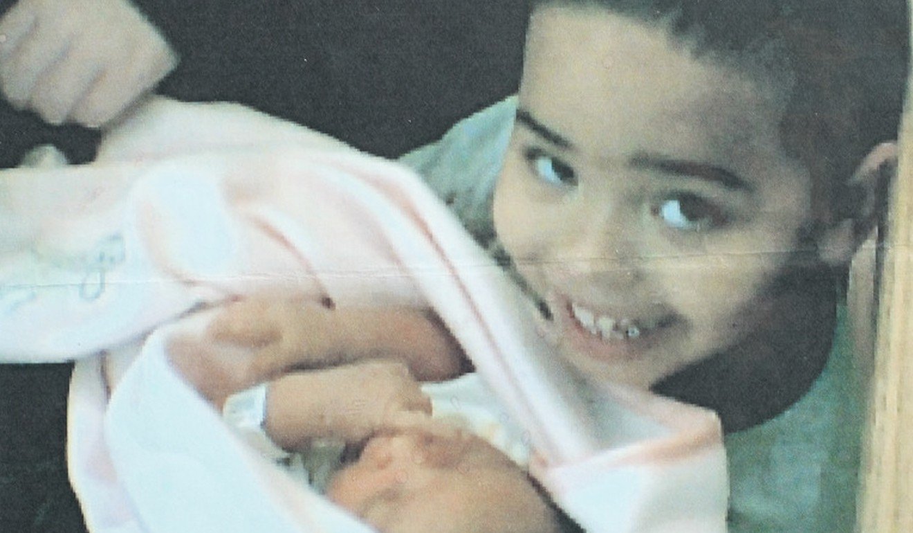 Andre Lee is seen with his half-sister Leyha Hughes. Both children were killed and mutilated, along with their mother, Laura Boren, by Andrew Thomas Snr on February 15, 2005. Photo: the Boren family via the Texas Tribune