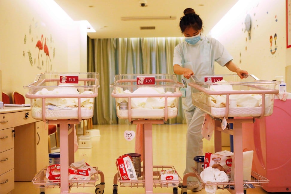 A staff member takes care of babies at a care centre in Shanghai. Mothers pay up to 70,000 yuan (US$10,900) a month to stay at the facility with their newborns. Photo: AFP