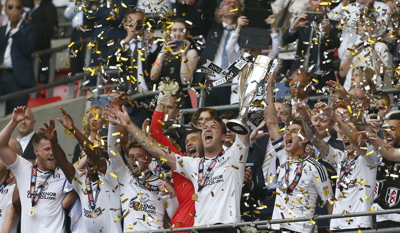 Fulham players celebrate after winning the English Championship play-off final. Photo: AFP