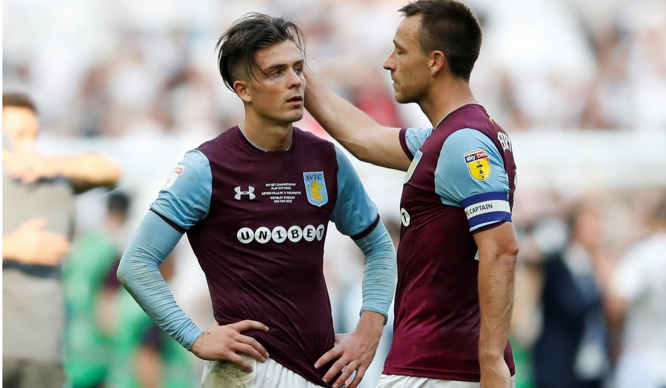 Aston Villa defender John Terry (right) tries to console striker Jack Grealish after their play-off match. Photo: Reuters