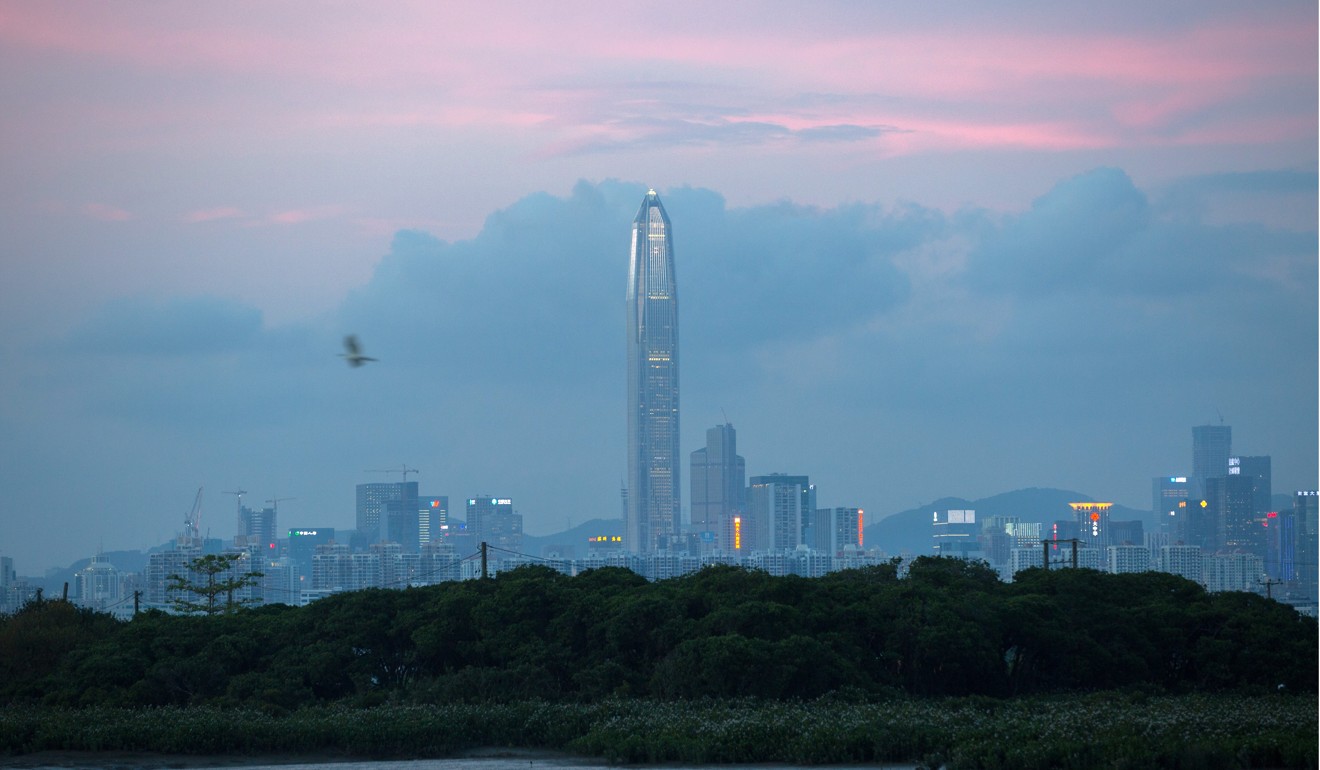 A view of the Shenzhen skyline from across the Kam Tin River in Hong Kong. Many Hong Kong permanent residents working in mainland China shuttle to and fro and maintain a home in Hong Kong. Photo: EPA-EFE