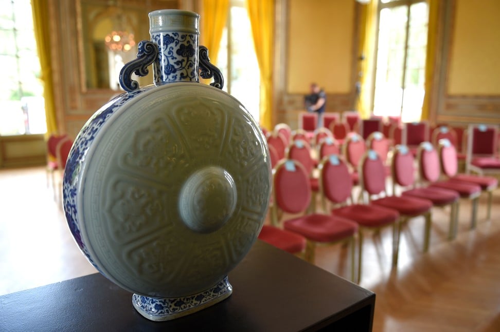 The rare blue, white and celadon porcelain moon flask belonging to the Emperor Qianlong is seen on Sunday. Photo: AFP