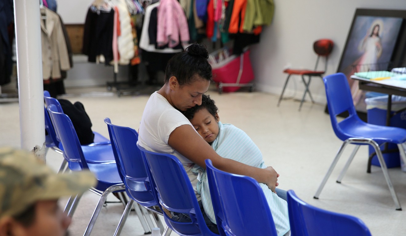 An undocumented Honduran immigrant and her son, recently released from detention through ‘catch and release’ immigration policy, pass time at the Catholic Charities relief centre in McAllen, Texas, on April 14. Photo: Reuters