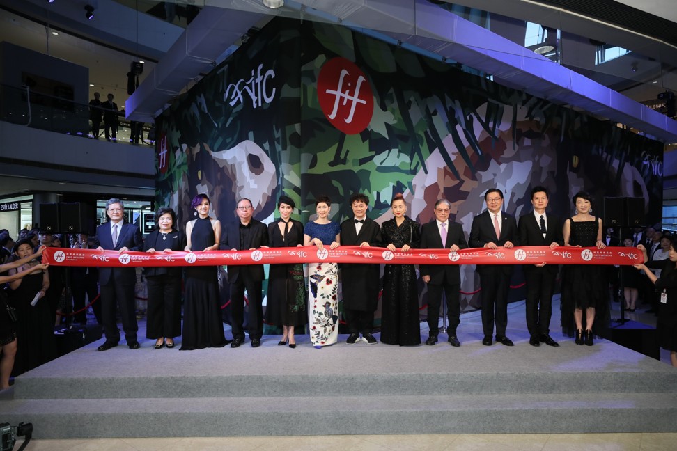 Guests attend the ribbon-cutting and unveiling of the T.rex dinosaur skeleton at IFC Mall, Central.