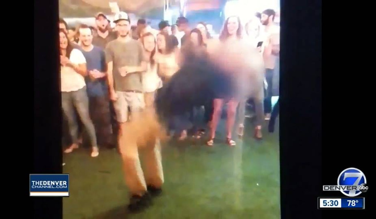 Off-duty FBI agent Chase Bishop launches into a backflip in a crowded Denver bar on June 2. Bishop dropped his gun during the move and accidentally shot a patron in the leg. Photo: ABC Denver 7