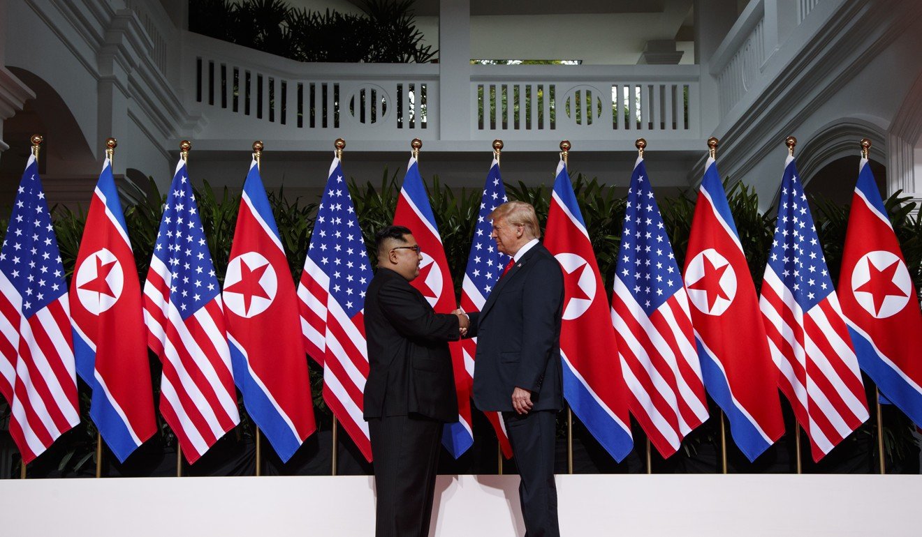 North Korean leader Kim Jong-un comes to grips with US President Donald Trump on Sentosa Island in Singapore on Tuesday. Photo: AP