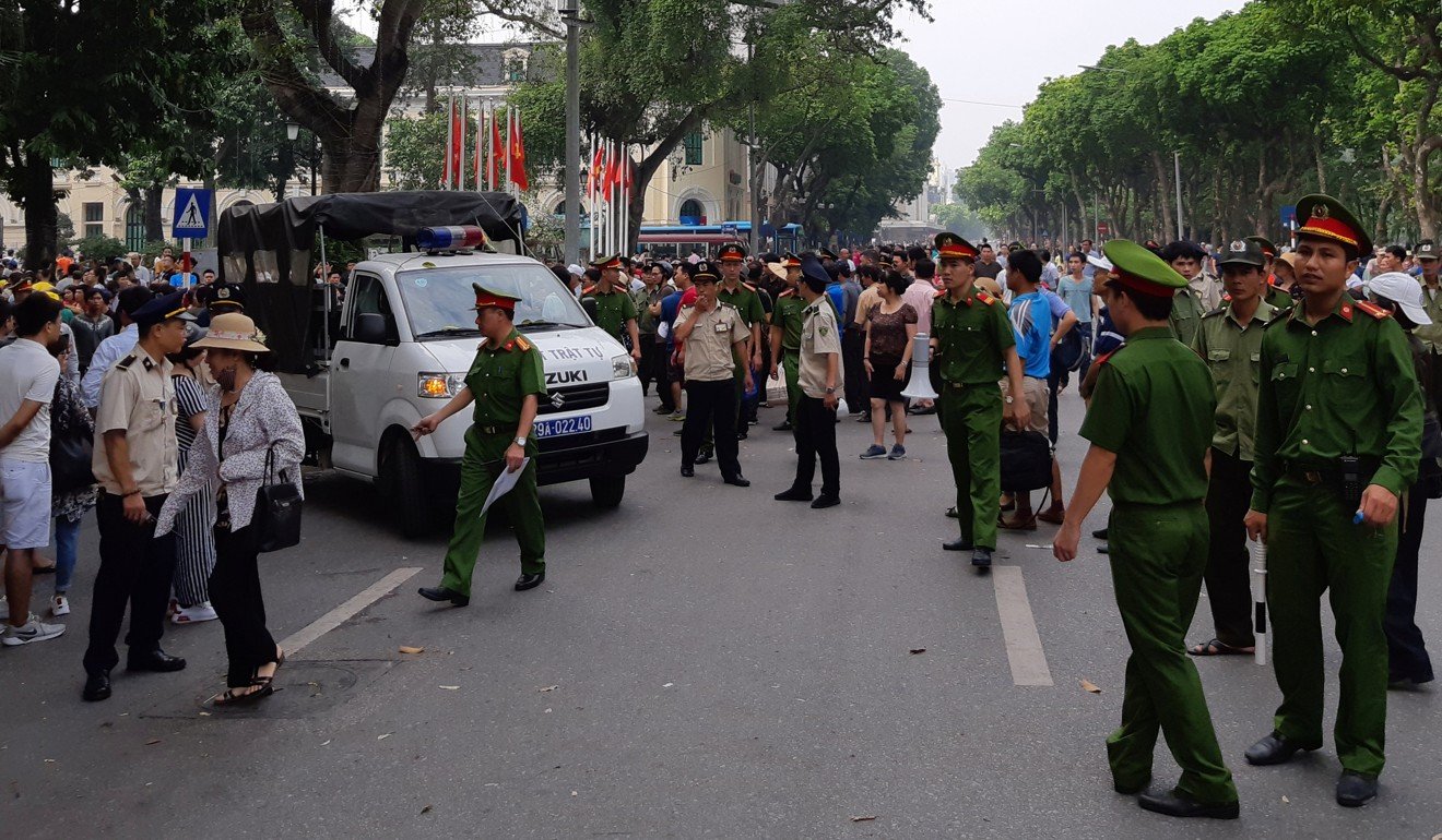 Police break up a demonstration in Hanoi on Sunday. Photo: Reuters
