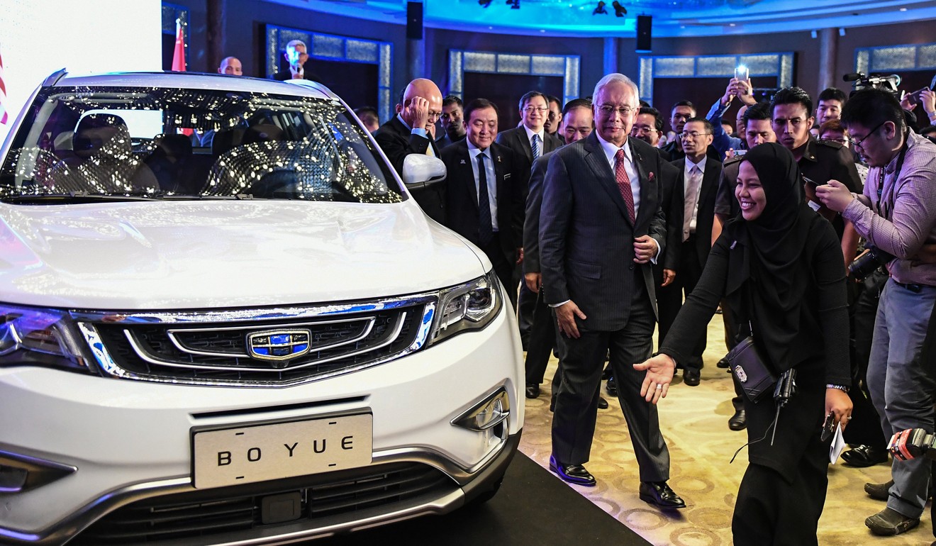 Najib Razak attends a public viewing of the Geely Boyue SUV. Najib had been critical of Mahathir’s continued involvement with Proton. Photo: AFP