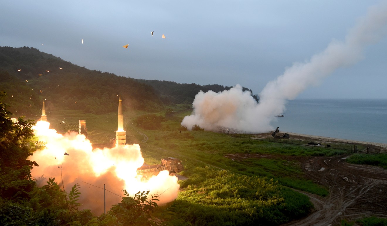 South Korea's Hyunmoo II Missile system (left) and a US Army Tactical Missile System (right) are fired during a combined military exercise in South Korea in December 2017. Photo: South Korea Defense Ministry via AP