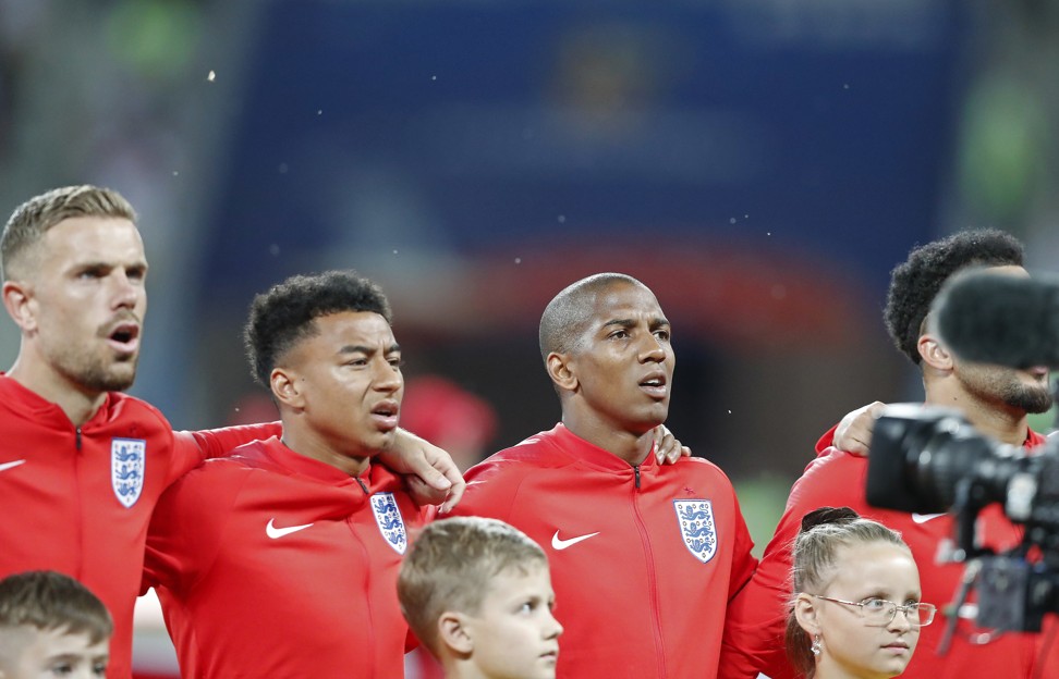 Flies surround the English team during the national anthem. Photo: AP