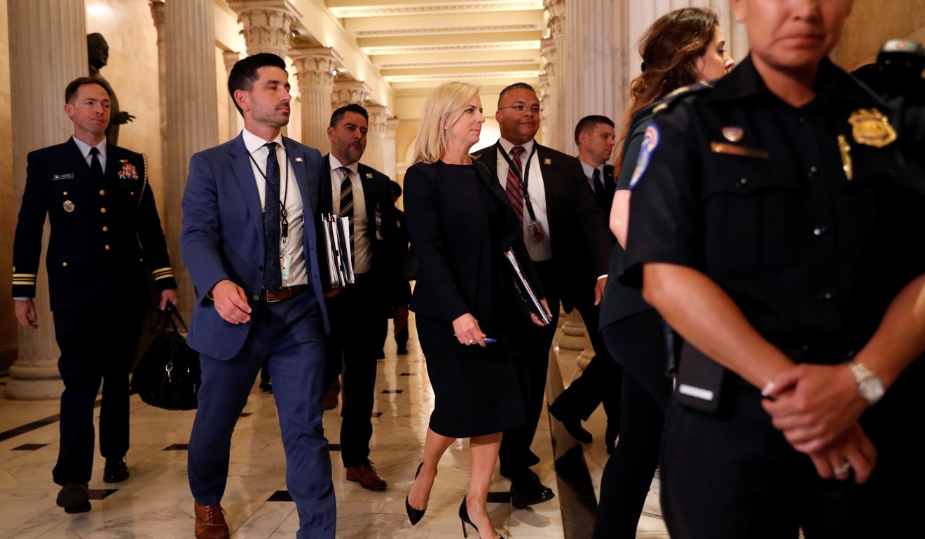 US Homeland Security Secretary Kirstjen Nielsen departs behind US President Donald Trump after attending a closed House Republican Conference meeting at the US Capitol in Washington on Tuesday. Photo: Reuters