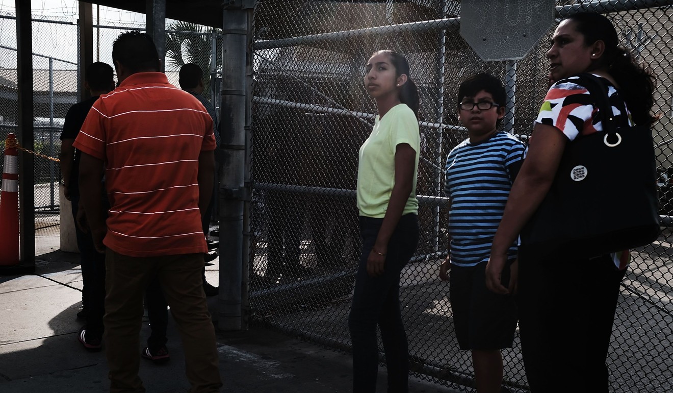 Mexican residents wait on Friday to make the daily crossing into the US border city of Brownsville, Texas, which has become dependent on the daily crossing into and out of Mexico. Photo: Getty Images/AFP