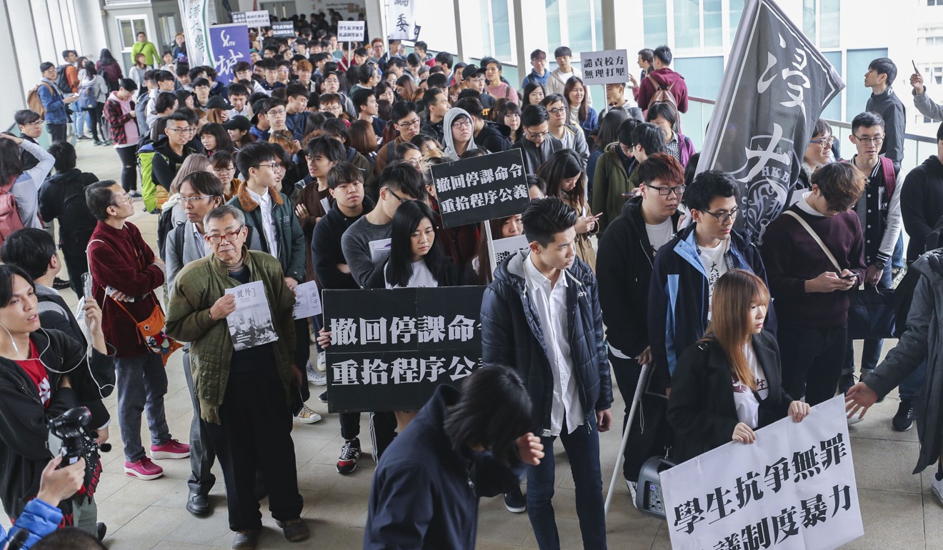 Baptist University students protest after the university suspended union president Lau Tsz-kei for his role in the stand-off in January. Photo: Winson Wong