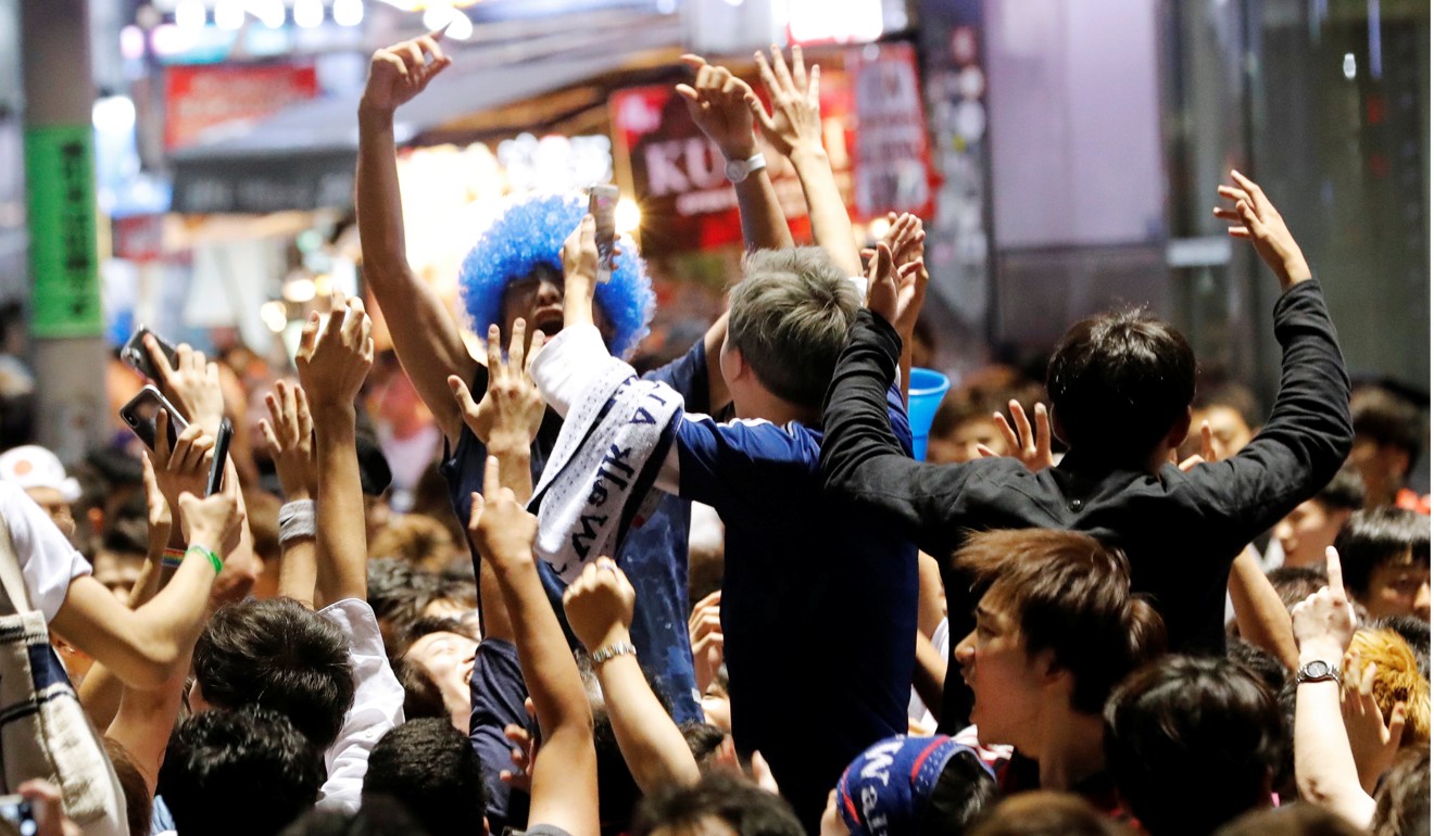 Japanese fans following the game against Poland. Photo: Reuters