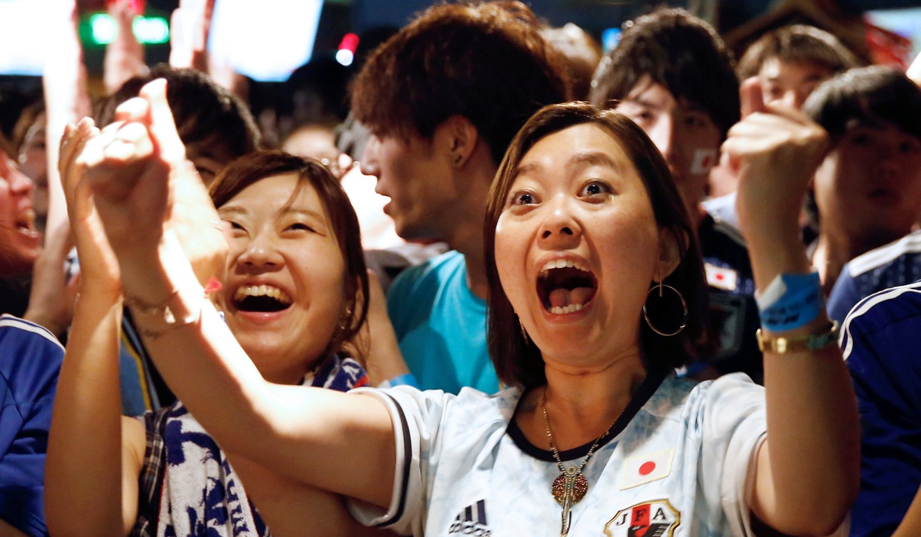 Japanese fans react as they watch the World Cup match against Poland. Photo: Reuters