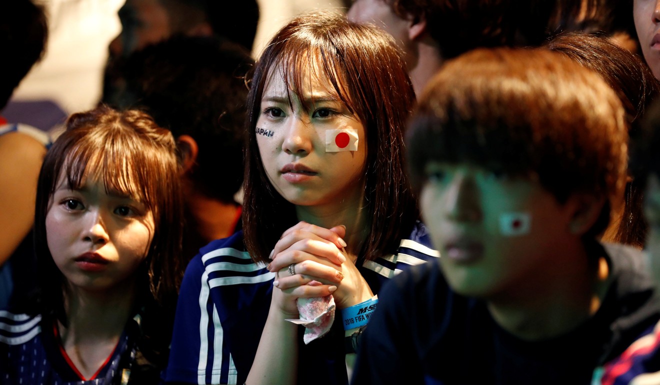 Anxious Japanese fans watching the football. Photo: Reuters