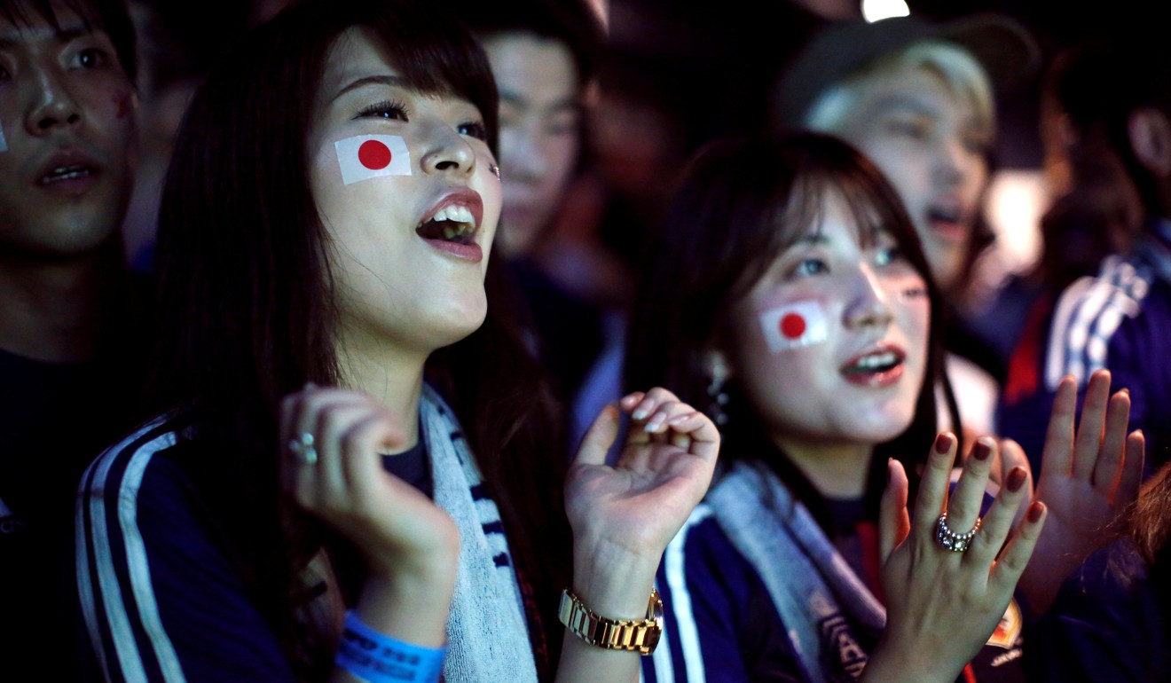 Japanese fans react as they watch the World Cup match against Poland. Photo: Reuters