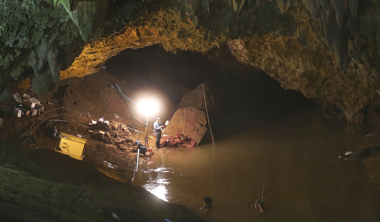 Flood water fills the entrance to the cave. Photo: AP