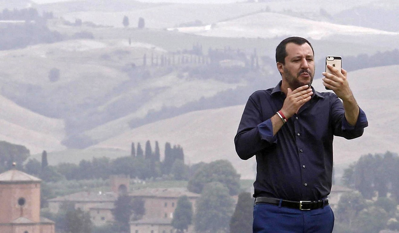 Italian Interior Minister Matteo Salvini takes a selfie during a visit to an estate that was confiscated from the mafia. Photo: EPA-EFE