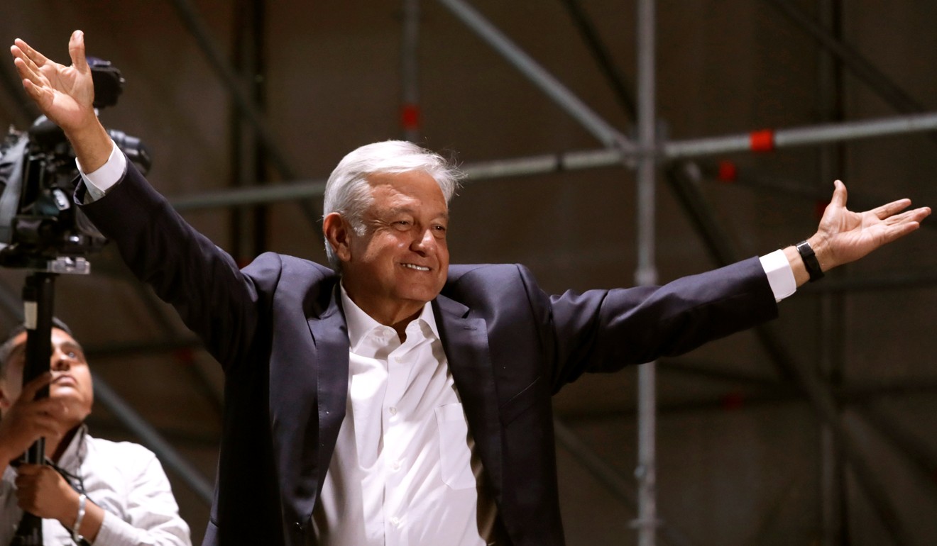 Andres Manuel Lopez Obrador, Mexico’s president-elect, gestures to supporters in Mexico City on Sunday, the day he won a landslide victory. Photo: Reuters