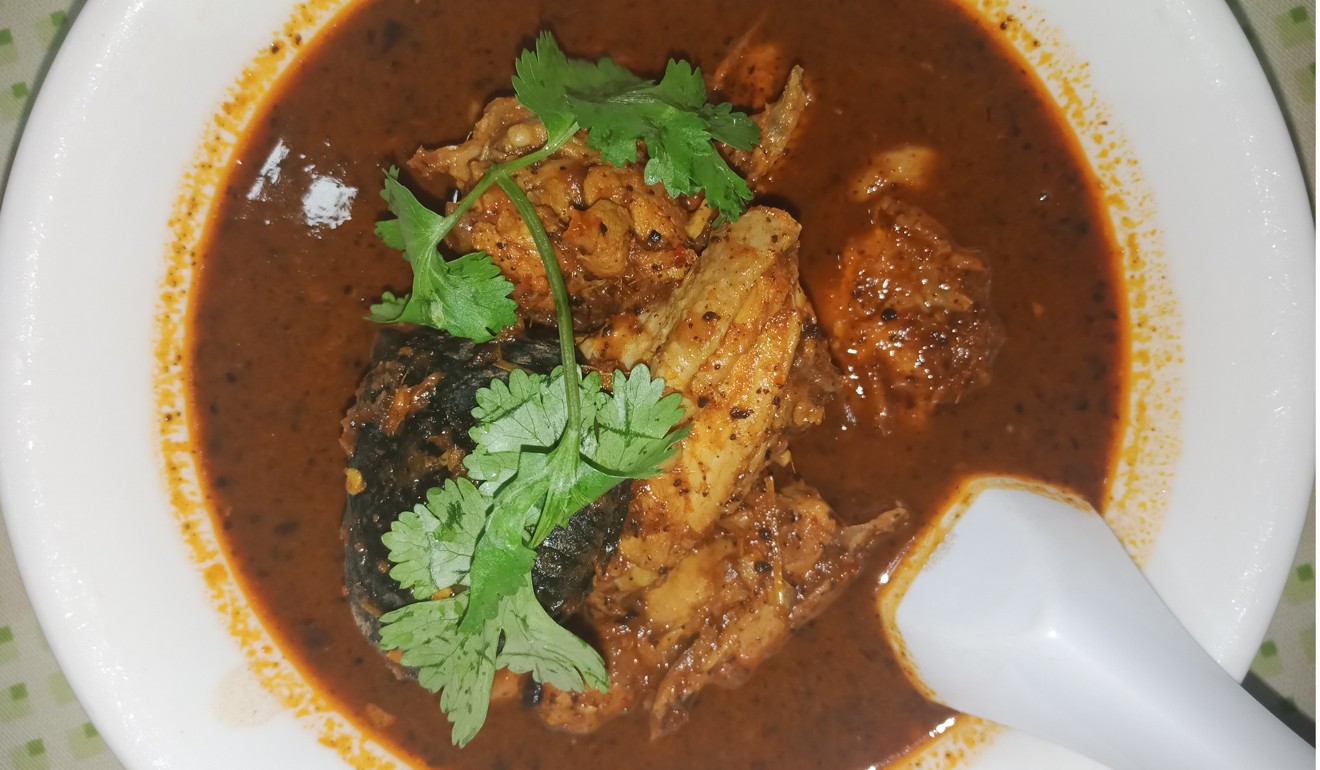 Ayam buah keluak, a quintessentially Peranakan dish.