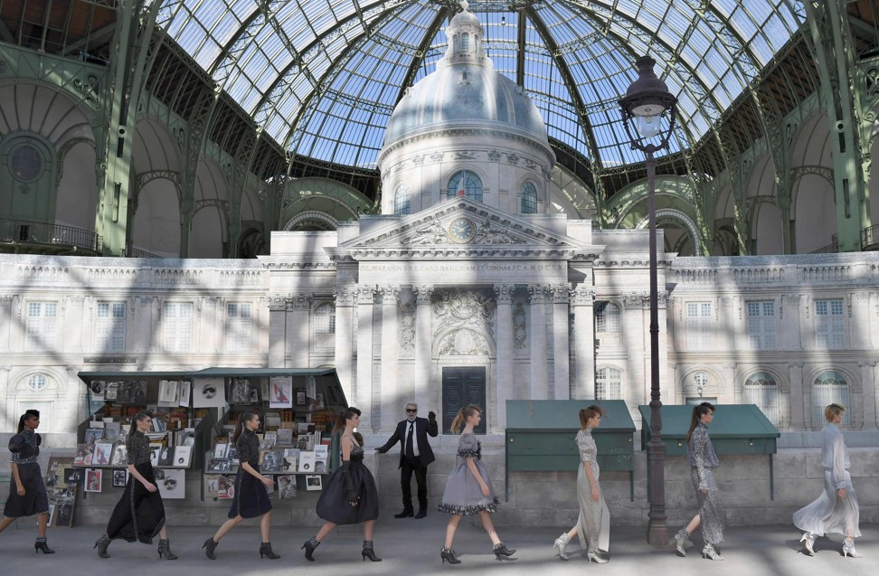 Lagerfeld set his Chanel haute couture show in front of a replica of the Académie française, placed inside the Grand Palais in Paris. Photo: AFP / Alain Jocard