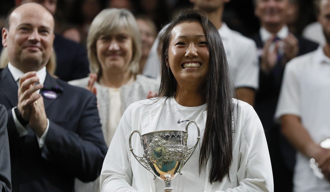 Claire Liu with the trophy after winning the girls’ singles at Wimbledon. Photo: AP