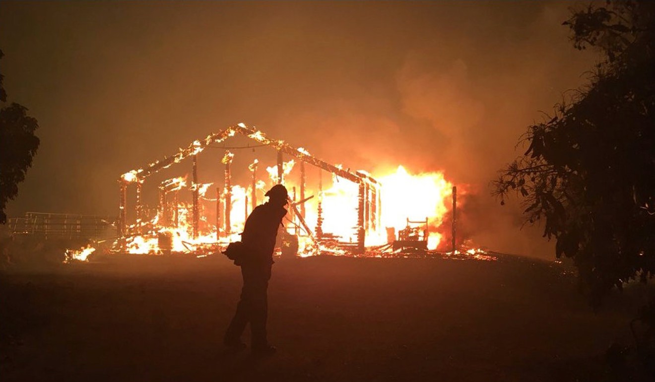 A fire burning a structure in Goleta, California. Photo: Reuters