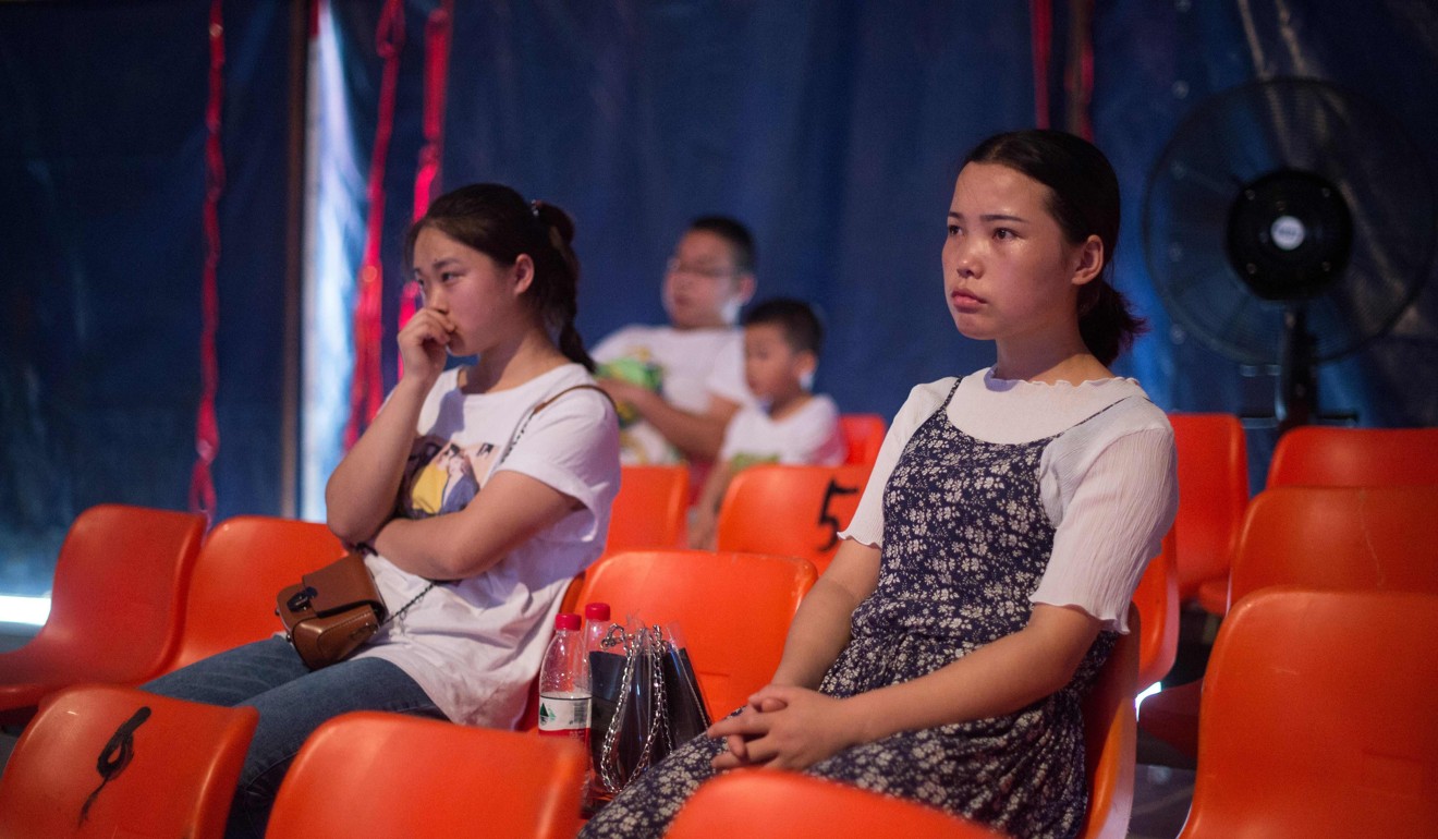 A few spectators watch the Chinese Prosperous Nation Circus Troupe’s show. Photo: AFP