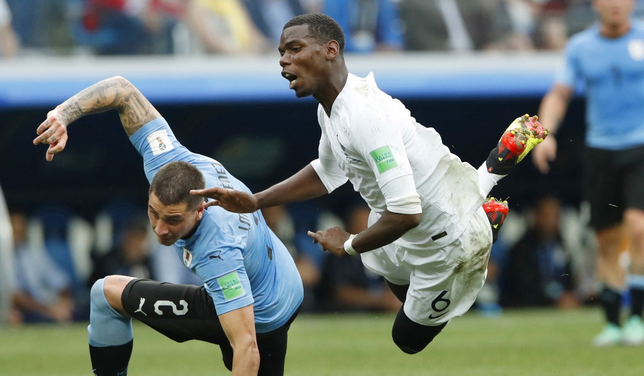 Paul Pogba of France is fouled in the quarter-final. Photo: Kyodo