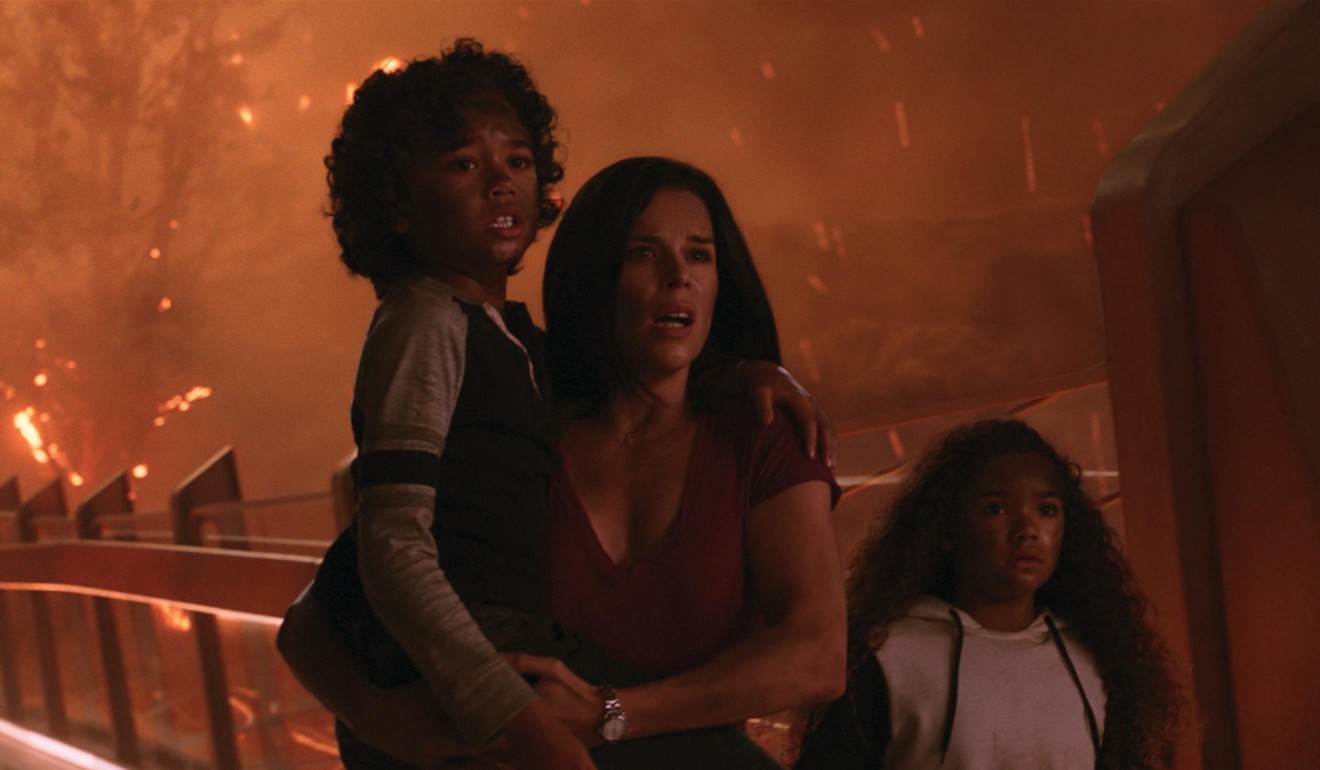 Noah Cottrell, Neve Campbell and McKenna Roberts play the protagonist's family in Skyscraper.